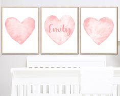 three pink watercolor hearts with the word family on them