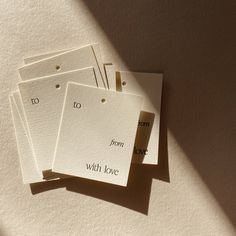 five cards with words written on them sitting next to each other