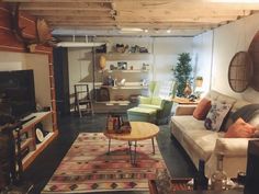 a living room filled with furniture and a flat screen tv