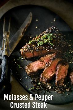 steaks and pepper crusted steak on a plate with a knife next to it