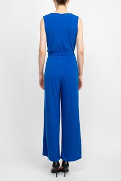 This stylish Nina Leonard V-Neck Back Zipper Sleeveless Front Tie Waist Jersey Jumpsuit is perfect for any casual occasion. Featuring a v-neck neckline, back zipper, sleeveless cut, and front tie waist, it provides all the necessary style while maintaining comfort. It's a must-have addition to any wardrobe! Versatile Sleeveless Jumpsuits For Work, Versatile Sleeveless Jumpsuits And Rompers For Loungewear, Versatile Sleeveless Jumpsuits And Rompers In Solid Color, Versatile Sleeveless Jumpsuits And Rompers, Versatile Sleeveless Solid Jumpsuits And Rompers, Spring Sleeveless Jumpsuits And Rompers, Versatile Sleeveless Jumpsuits For Spring, Versatile Sleeveless Jumpsuits And Rompers For Spring, Jersey Jumpsuit