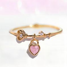 Description:Crystal Heart Lock RingSpecifications:Material: cubic zirconia, copper, 18k gold, crystalColors: GoldSize: #7Weight: 2 g/pcs Unlock your heart with this charming Crystal Heart Lock Ring! This trendy piece features a sparkling crystal heart that adds a touch of whimsy to any outfit. With its playful design, this ring is sure to bring a smile to your face (and your loved ones). Lock Ring, Heart Lock, Enamel Bracelet, Gold Crystal, Sparkling Crystal, Love Ring, Crystal Heart, Playful Design, Real Gold