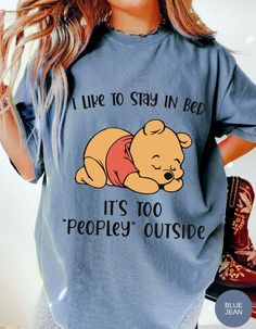 Wrap yourself in the warmth of relaxation with our "Cozy Hibernation Retreat Tee." This delightful shirt features Winnie the Pooh in his favorite spot, snug in bed, declaring, "I like to stay in bed. It's too peoply outside." Embrace the comfort of solitude and let the world outside fade away as you enjoy the tranquility of your own cozy sanctuary. Stay In Bed, Blue Jeans, Winnie The Pooh, Home Crafts