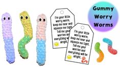 gummy wormy worms with tags on them and the words gummy worms written in white