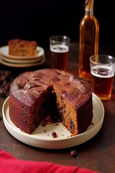 a chocolate cake on a plate with one slice cut out