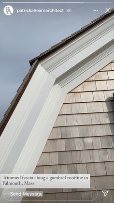 the corner of a house with a window and gutter on it's side