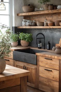 a kitchen filled with lots of wooden cupboards and pots on top of the counter