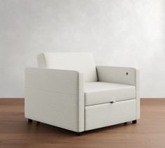 a white chair sitting on top of a wooden floor