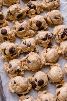 chocolate chip cookies are on a baking sheet and ready to be baked in the oven