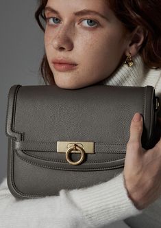 Inspired by Grace Kelly's enduring style, the Grace Medium Flap Bag is a timeless embodiment of classic elegance. This exquisite bag elevates sophistication with its signature lock closure, inspired by a vintage door handle. Crafted with full-grain textured calfskin from USA, this versatile companion strikes a harmonious balance between modern minimalism and timeless charm. Parisa Wang, Grain Texture, Modern Minimalism, Vintage Door, By Grace, Grace Kelly, Flap Bag, Classic Elegance, Door Handle