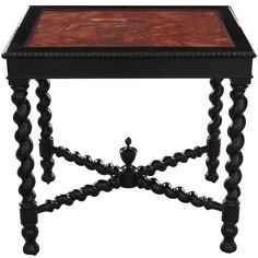 a small wooden table with black legs