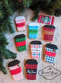 coffee cups decorated with plaid and christmas decorations