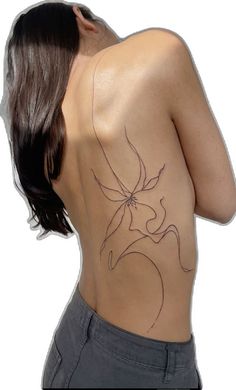 the back of a woman with a tattoo on her upper half and lower part,