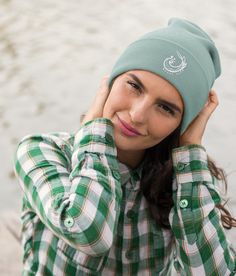 This organic beanie provides the ultimate comfort for wind-swept outdoor activities. With its breathable, lightweight fabric and wool-free design, this hat offers maximum comfort and style for those who embrace the great outdoors. Plus, our beanies are machine-washable, so you can enjoy the clean scent of freshness after your long journeys. A perfect accessory for hill climbing, shore exploring, and sea swimming, our beanie is eco-friendly and a must-have for any hat collection. 95% organic cott Organic Accessories, Ski Hat, White Beanies, Winter Hats For Men, Ski Hats, Clothing Gifts, Badge Design, Winter Beanie, Unisex Accessories