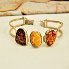 MULTI AMBER BRACELET, Sterling Silver Hinged Bracelet, Gift for Her by ANTIQUE4YOU Three amber bracelet, Multi color amber, Amber silver jewelry, Estate amber jewelry, Butterscotch amber, Cognac amber, Honey amber, Gift for Mother, Gift for wife. STAMPED 925 STERLING SILVER. 3 DIFFERENT COLOR AMBER STONES. ESTATE AMBER JEWELRY. 7.5"  GREAT GIFT FOR HER. *BEFORE PLACING ORDER, PLEASE, MAKE SURE YOUR ADDRESS IS CORRECT IF YOU PLACED ORDER WITH UNVERIFIED ADDRESS OR HAD MISTAKE IN IT AND IF PACKAGE Amber Bracelet, Amber Stone, Hinged Bracelet, Gift For Mother, Bracelet Sterling Silver, Amber Jewelry, Gift For Wife, Cute Earrings, Bracelet Gift