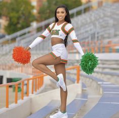 a cheerleader is posing on the bleachers with her pom - poms