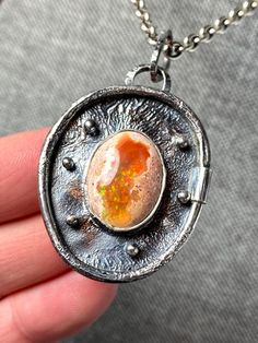 Amazing Rare Mexican Fire Opal Pendant in sterling silver  Materials:  Silver 925, Mexican Fire opal Height - 2 1/8" (full size with bail), Width - 1 1/4" Unique Handcrafted One-of a-kind Design Pendant Each Piece of Jewelry in my Collection is Absolutely One of a Kind! When you start wearing a piece of my jewelry you will fall in love with it more and more each day and feel that good Energy and Love that I pass into it while creating this piece of Art. A piece of Art created for you to be inspi Fusion Style Opal Jewelry Gift, Fusion Style Opal Jewelry For Gifts, One Of A Kind Silver Opal Jewelry, Collectible Silver Opal Jewelry, Unique Oval Opal Jewelry, Silver Opal Fusion Jewelry, Artisan Silver Opal Jewelry, Unique Round Ethiopian Opal Jewelry, Unique Oval Opal Necklaces