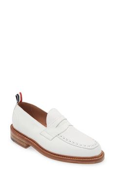 A tricolor grosgrain pull loop brings the label's signature flair to this calfskin-leather loafer detailed with classic broguing at the apron toe. Leather upper and lining/leather and synthetic sole Made in the UK Designer Shoes White Tassel Loafers With Rubber Sole For Formal Occasions, White Tassel Loafers With Leather Sole For Business, White Tassel Loafers With Brogue Detailing For Formal Occasions, White Tassel Loafers For Business, Luxury Loafers With Contrast Sole For Work, White Calf Leather Loafers For Work, White Leather Tassel Loafers For Business, White Cap Toe Leather Shoes For Work, White Brogue Dress Shoes For Work