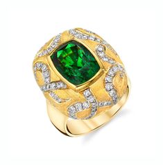 This bold ring makes a statement! The stunning 7.26 carat tsavorite garnet featured in this ring possesses a vivid, rich green color and unusually high level of clarity. Round brilliant cut diamonds set in dramatic swirls around the center bezel create a striking contrast of texture and color against the elegant matte finish. Handmade by our Master Jewelers, this one-of-a-kind ring will attract attention wherever you go!Tsavorite garnet measures 12.1 x 8.4mm, 7.26 caratsRound brilliant cut diamo Luxury Formal Tsavorite Ring, Luxury Tsavorite Round Cut Emerald Ring, Luxury Classic Tsavorite Diamond Ring, Luxury Tsavorite Round Ring, Luxury Green Tsavorite Diamond Ring, Luxury Tsavorite Rings With Round Cut, Luxury Tsavorite Diamond Ring, Luxury Tsavorite Round Cut Rings, Luxury Tsavorite Rings