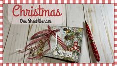 a red and white checkered table cloth with a christmas ornament on it