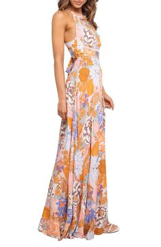 Step out in stunning, boho-chic style in this floral-print maxi dress flaunting a tie at the open back and a smocked waist for definition. Ties behind back; back button closure Sleeveless Partially lined 100% rayon Hand wash, dry flat Imported Multicolor V-neck Maxi Dress With Smocked Back, Bohemian Maxi Dress With Smocked Back For Brunch, Beach Season Printed Maxi Dress For Brunch, Bohemian Maxi Dress With Smocked Back For Summer, Printed Maxi Dress For Garden Party, Floor-length Smocked Back Dress For Vacation, Floor-length Smocked Back Vacation Dress, Floor-length Vacation Dress With Smocked Back, Multicolor Smocked Back Maxi Sundress