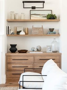 a living room filled with furniture and shelves