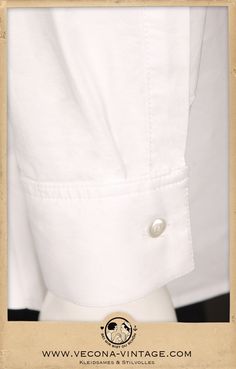 "Complete your Vecona Vintage outfit with our classic 1930s Oxford shirt. Spearpoint collar, half-placket, and gussets at the side seams are the most remarkable details of this 100% cotton shirt. It opens with a row of real mother-of-pearl buttons. The fine oxford shirting has a sophisticated texture that goes perfectly with tweed, gabardine and linen. Color white Material 100% cotton Size S: collar 37cm / 14.5\" Size M: collar 39cm / 15.5\" Size L: collar 41cm / 16\" Size XL: collar 43cm / 17\" Timeless White Shirt With Placket, Classic Shirt With Johnny Collar And Button Closure, Unstructured White Shirt For Daywear, White Dress Shirt For Daywear, Classic Shirt With Johnny Collar, Classic Formal Shirt With Johnny Collar, Classic White Dress Shirt With Placket, Classic Johnny Collar Shirt For Daywear, The Cotton Club