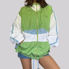 Vintage sports jacket / windbreaker from the 90s. Brand Reebok. Size 40 - exact dimensions see below. In the colors green / blue / white. Outer material made of polyamide, polyester. Sleeves made of nylon. Lining made of 50% cotton and 50% polyester. Washable at 40 degrees. Zip closure. Two pockets on the outside. Very nice vintage condition - jacket shows few, minimal signs of wear. No damage such as holes or stains. / Chest width simply lying flat / 64.5 cm / Length / 60.5 cm The model is size XS and is 160 cm tall. The clothes are delivered to you freshly washed or cleaned. Green Nylon Track Jacket For Outdoor Activities, Green Long Sleeve Track Jacket For Streetwear, Green Track Jacket For Spring Outdoor Activities, Retro Spring Windbreaker For Outdoor, Green Spring Track Jacket For Outdoor Activities, Sporty Green Outerwear For Spring, Sporty Green Spring Outerwear, Retro Spring Track Jacket For Outdoor, 90s Hooded Windbreaker For Spring