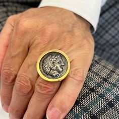 This is a large version of our signet ring design that is based off a pontiffs intaglio ring for wax seals. The coin set in the ring is an oxidized silver casting of a vintage greek coin featuring Alexander The Great. Oxidized silver has a beautiful historic feel for jewelry (think Austro-Hungarian empire) and is a wonderful contrast to the yellow gold. MATERIAL: 18k yellow gold, Oxidized Silver DIMENSIONS: 1.25″ diameter Signet Ring Design, Silver Casting, Ancient Roman Coins, Greek Coins, Coin Set, Coin Ring, Alexander The Great, Sapphire Pendant, Oxidized Silver