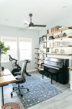 a living room filled with furniture and a piano