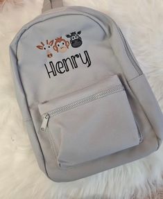 Personalised embroidered backpack with name stitches in navy thread Perfect for toddlers Size 35 by 23 by 12 cm Fully adjustable with shoulder straps with zipped compartments Backpack Embroidery, Embroidered Backpack, Toddler Backpack, Personalized Embroidered, Safari Animals, Kids Backpacks, Toddler Sizes, Drawstring Bag, Shoulder Straps