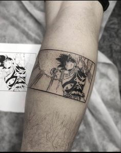 a man's arm with a tattoo on it that has an image of gohan