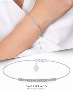 Delicate by design, this diamond bar tennis bracelet is so easy to wear and style. The gently curved bar is enveloped beneath a blanket of shimmering 0.28ct pavé diamonds. Set on a slim 14k white gold chain, this tennis bracelet is an ideal layering piece.  TB4212W45JJ #GabrielNY #DiamondJewelry #FineJewelry #GabrielAndCo #UniqueJewelry #FineJewelry#FashionJewelry#UniqueJewelry#GiftIdeas#UniqueGifts #DiamondJewelry #Jewelry#YellowGold Bangle   #Bangles #Bracelets Minimalist Luxury Bracelets With Diamond Accents, Casual White Bracelet, Luxury Minimalist Bracelets With Diamond Accents, Luxury Minimalist Diamond Accented Bracelet, Luxury White Gold Chain Bracelet For Parties, Luxury Classic Chain Bracelet For Engagement, Luxury White Chain Bracelet For Anniversary, Luxury Diamond White Chain Bracelet For Formal Occasions, Luxury Diamond White Chain Bracelet For Gift