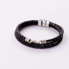 Men's Braided Leather Bracelet with Small Custom Beads in Silver - MYKA Classic Black Braided Bracelet, Classic Braided Leather Bracelets, Adjustable Leather Braided Bracelet With Stainless Steel Clasp, Masculine Adjustable Braided Bracelets With Leather Strap, Handmade Modern Black Braided Bracelets, Masculine Adjustable Braided Leather Bracelet, Handmade Modern Black Braided Bracelet, Everyday Black Braided Leather Bracelet, Classic Black Braided Jewelry