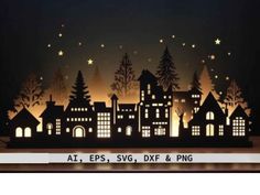 a paper cut out of a city at night with stars and trees on the sky