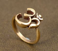 Om Ring, Designer Brass Ring, Spiritual Ring, Fathers Day Gifts, Meditation Ring, Ohm Ring, Brass Religious Ring, Graduation Gifts SIZE :- All Size Are Available, choose from variation. METAL :- Brass ❥ Customers satisfaction is our biggest priority, please contact us with any questions/queries for future or existing orders, and we will do our best to make sure you are happy with your order. ♥ Please Make Sure to Include The Correct Address During Before Order. You Can return Item within 30 Days Symbolic Brass Engraved Ring For Wedding, Symbolic Brass Wedding Rings, Ohm Ring, Ohm Jewelry, Spiritual Ring, Yoga Ring, Gold Mangalsutra Designs, Zierlicher Ring, Gold Rings Fashion