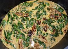 a pizza with spinach and cheese in a pan