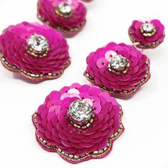 pink flowers with crystal centers on white background