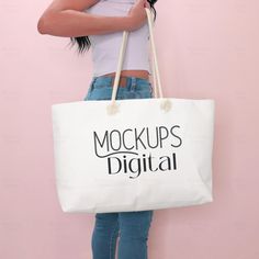 This is a weekender tote bag mockup. Image size 4000 by 4000 px   This listing includes 1 JPG only.  The mockup in the video is NOT included. Weekender Bag Mockup, Weekender Mockup, Weekender Tote Bag, Weekender Bag Mock Up, Weekender Bag Mock-Up, Rope Handle Bag Mockup, Tote Mock 🌞🌞This link will take you directly to the my tote bag mockups section: https://www.etsy.com/shop/mockupsdigital?ref=seller-platform-mcnav§ion_id=38904907 🌞🌞This link will take you directly to the my AOP tote bag size chart: https://www.etsy.com/listing/1304731300/printify-tote-bag-aop-tote-mockup-tote 🌞🌞Comfort Colors Mockup Click Here: https://www.etsy.com/shop/mockupsdigital?ref=seller-platform-mcnav§ion_id=39642736 ✌Sign up to download your three free mockups and to get exclusive discount codes. https:// My Tote Bag, Tote Bag Mockup, Photo Bag, Bag Mockup, Styled Stock Photos, Halloween Bags, Weekender Tote Bag, Up Halloween, Canva Design