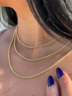 Details: 18k Gold~ 40 cm, 2,41-gram, width~ 2,5 mm 18k Gold~ 45 cm, 3.84-gram, width~ 3 mm 18k Gold ~ 50 cm, 5,4 gram Are you looking for a gold rope chain? Look no further! Our 18k gold necklace is the epitome of luxury, featuring a stunning rope chain design. Perfect for both men and women, this solid gold bracelet adds a touch of sophistication to any ensemble. Handcrafted with care, this gold rope bracelet is a dainty yet striking piece suitable for everyday wear or special occasions. Indulg Rope Chain Necklace Gold, Gold Necklace Dainty, Real Gold Necklace, Necklace Rope, Twisted Chain, Chain Necklace Gold, Solid Gold Bracelet, 18k Gold Necklace, Gold Rope Chains