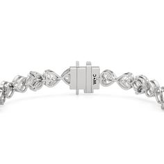 A tennis bracelet with a floral motif, perfect for the romantic at heart. Showcasing a pattern of tulips, it features a combination of marquise and princess-cut diamonds on elegant V-prongs, and bezel-set heart-shaped diamonds. With a touch of nature's beauty, this diamond bracelet is bound to give your looks a dreamy and modernly feminine finish. Luxury Marquise Cut Bracelets For Anniversary, Luxury Marquise Cut Diamond Bracelet For Anniversary, Marquise Diamond Accent Bracelets For Anniversary, Elegant Silver Heart-shaped Tennis Bracelet, Elegant White Gold Heart-shaped Tennis Bracelet, Elegant White Gold Heart Tennis Bracelet, Elegant Heart Bracelet With Diamond Accents, Elegant Heart Cut Tennis Bracelet For Weddings, Elegant Marquise Tennis Bracelet For Anniversary