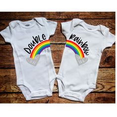 two baby onesuits with the words double rainbow on them