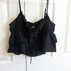 The Floral Pic Is A Better Picture Of The Style Black Ruffled Summer Top, Black Ruffled Crop Top For Summer, Black Cotton Summer Crop Top, Spring Black Ruffled Crop Top, Black Ruffled Crop Top For Spring, Black Crop Top For Spring Vacation, Black Crop Top For Vacation In Spring, Frilly Crop Top, Polo Crop Top