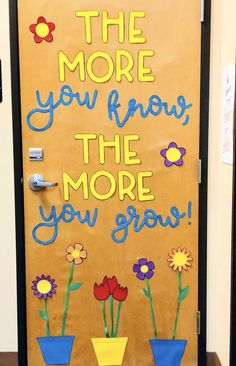 a door decorated with flowers and the words'the more you know, the more you grow '