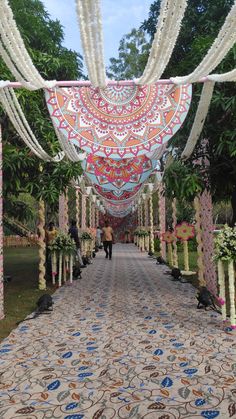 the walkway is decorated with flowers and garlands