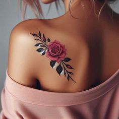 a woman with a rose tattoo on her shoulder and chest is wearing a pink dress