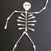 a white skeleton with arms and legs is standing in front of a black background,