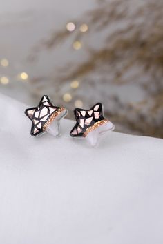 Shining star earrings made with rose gold mirror foil. Diameter : 0.63 x 0.63 in / 16 x 16 mm Earrings are made on a epoxy resin base with epoxy finish on top.  They have stainless steel posts. Very small and lightweight.  Perfect for a birthday gift, anniversary gift, back to school gift. If you have any questions, feel free to send me an etsy message. For more of my work visit my shop : https://www.etsy.com/shop/TikoloByTijana Come and say hi on Instagram : www.instagram.com/tikolobytijana Rose Gold Star Charm Earrings, Rose Gold Star Earrings With Star Charm, Rose Gold Star-shaped Earrings With Star Charm, Rose Gold Star Earrings For Gift, Rose Gold Star Jewelry For Parties, Rose Gold Star-shaped Party Jewelry, Rose Gold Earrings With Star Charm As A Gift, White Star-shaped Earrings As Gift, Mosaic Star