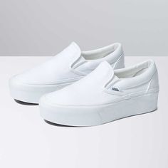 Classic Slip-On Stackform Shoe Thick Bottom Slip-on Platform Sneakers For Streetwear, White Slip-on Sneakers With Platform And Round Toe, White Platform Slip-on Sneakers With Round Toe, White Slip-on Sneakers With Platform, Synthetic Platform Slip-ons, White Vulcanized Sole Slip-ons For Streetwear, White Slip-on Platform Sneakers With Thick Bottom, Vans Platform Sneakers With White Sole, White Low-top Platform Slip-on Sneakers