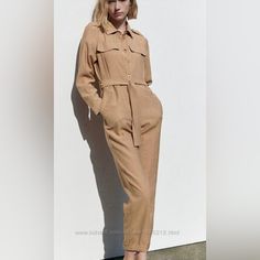 Nwt And With Defects. -*****Missing Belt *** Buttons Closure. Flap Pockets Shoulder: 17” Bust: 19” Waistband: 19” Rise: 14” Inseam: 27” Color: Camel Beige Jumpsuits And Rompers For Fall Workwear, Beige Fall Jumpsuits And Rompers For Work, Elegant Zara Jumpsuits And Rompers With Pockets, Casual Beige Pantsuit For Spring, Zara Beige Jumpsuits And Rompers For Work, Zara Long Sleeve Jumpsuits And Rompers For Fall, Zara Beige Jumpsuit For Workwear, Zara Long Sleeve Jumpsuits For Fall, Spring Beige Pantsuit With Pockets